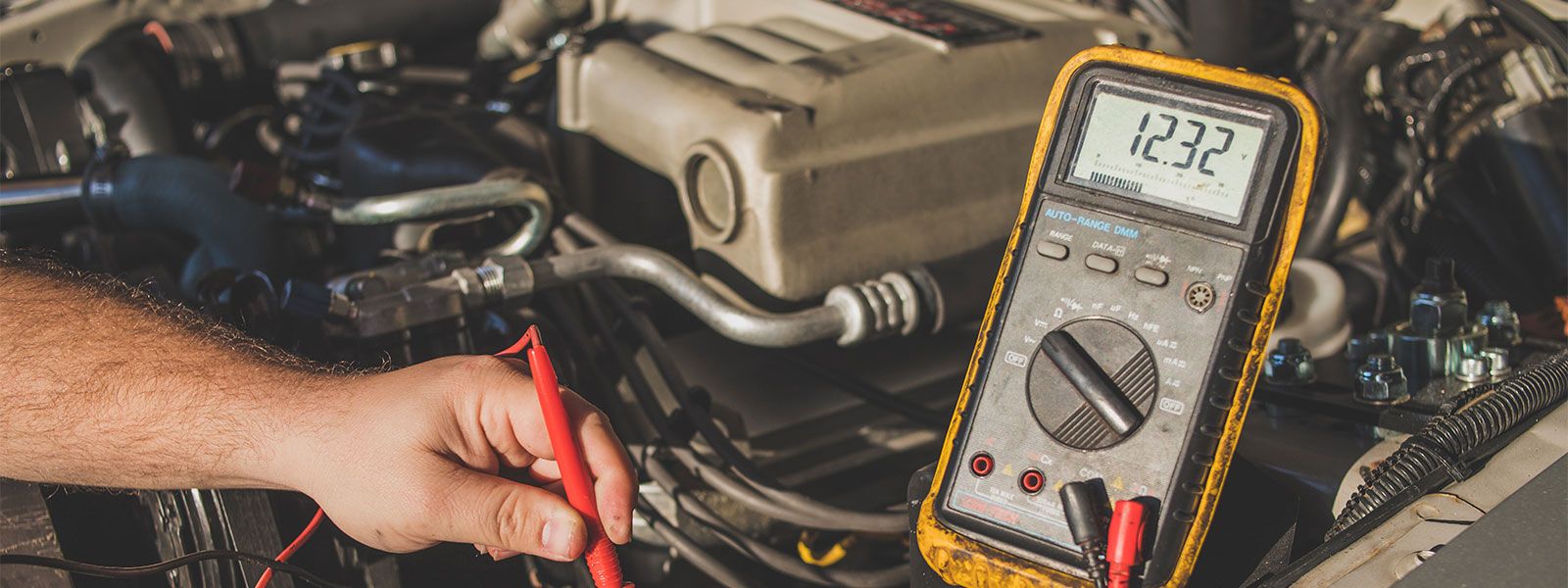 How do you test an alternator with a voltmeter